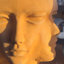Faces terracotta planter