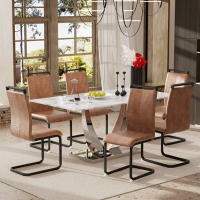 Ensemble de table de salle à manger en marbre blanc avec chaises rembourrées en polyuréthane 4/6, base en forme de corne pour une cuisine moderne