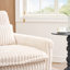 Fauteuil beige confortable pour petit appartement avec balcon et canapé-lit