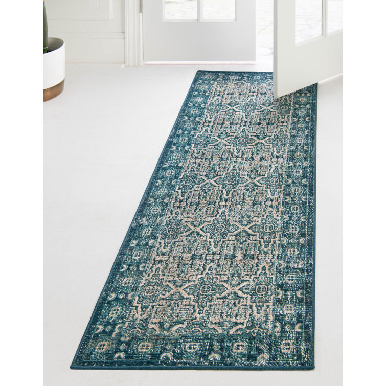 Tapis bleu à motif géométrique 