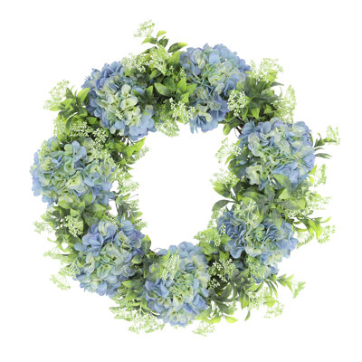 Couronne de printemps avec hortensias et fleurs en herbe