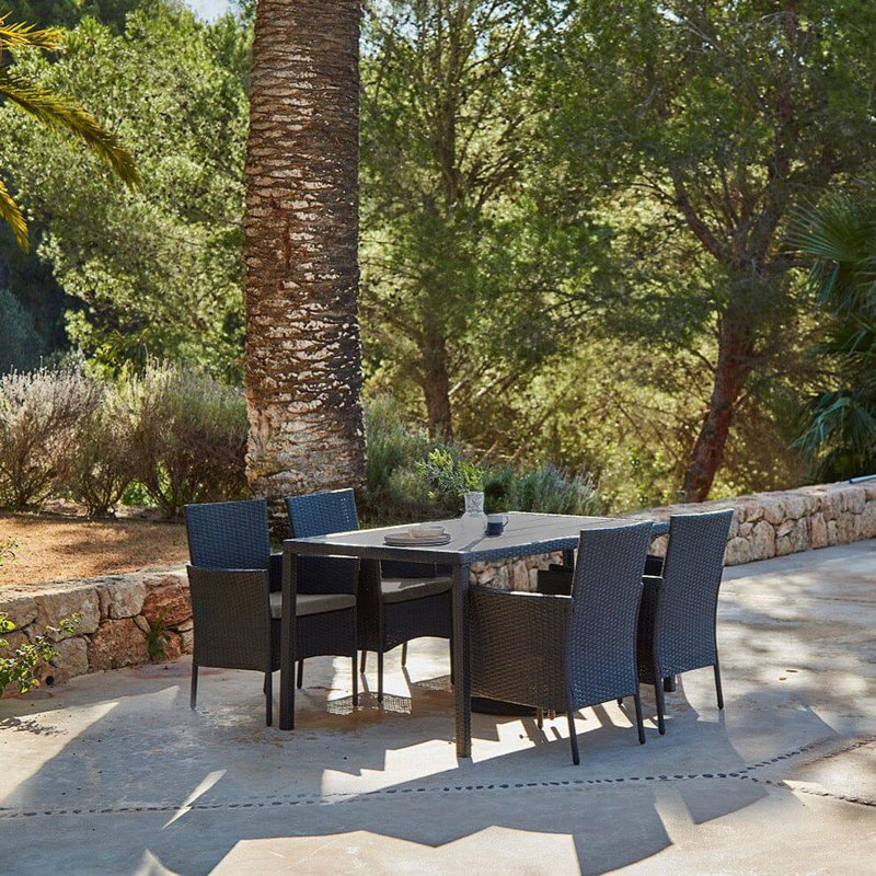 Renfoe 4 - Person Wicker Patio Dining Set with Rectangular Table , Cushions Included, Black
