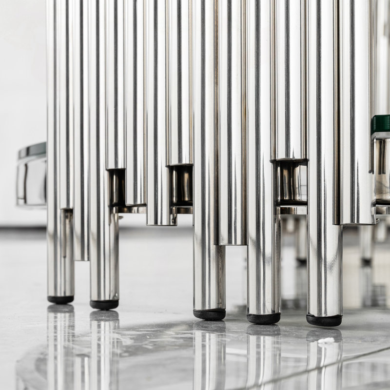 Table basse ronde en verre avec structure en acier inoxydable argenté