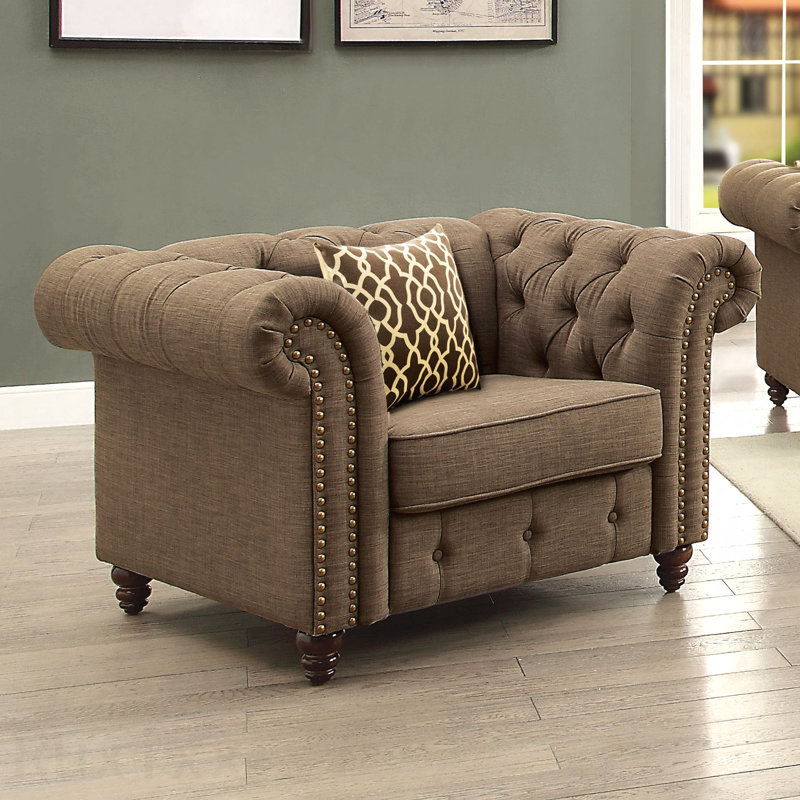 Fauteuil d'appoint brun capitonné avec coussin pour les salons confortables