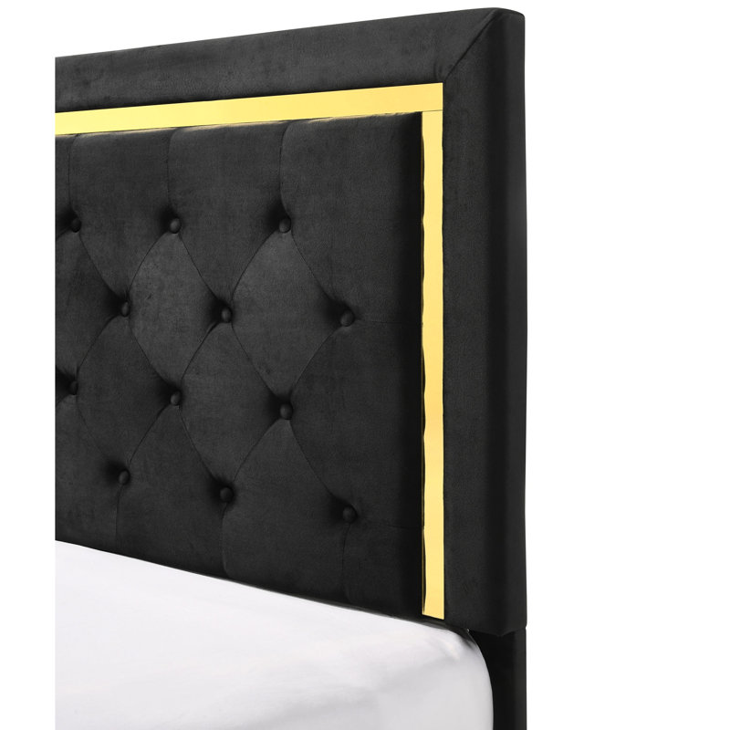 Lit très chic avec un tissu d'ameublement noir et des lattes dorées supportant des rails élégants en tissu d'ameublement doré