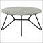 Table basse Travis en ciment et bronze industriel avec charme industriel et élégance moderne, parfaite pour les espaces de vie élégants.