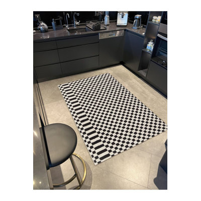 Tapis lavable noir à motif géométrique à carreaux