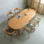 Table de salle à manger brune en bois massif ovale-374670037