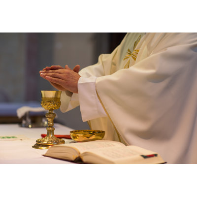 Priest During A Wedding Ceremony/Nuptial Mass by ViktorCap - Wrapped Canvas Print