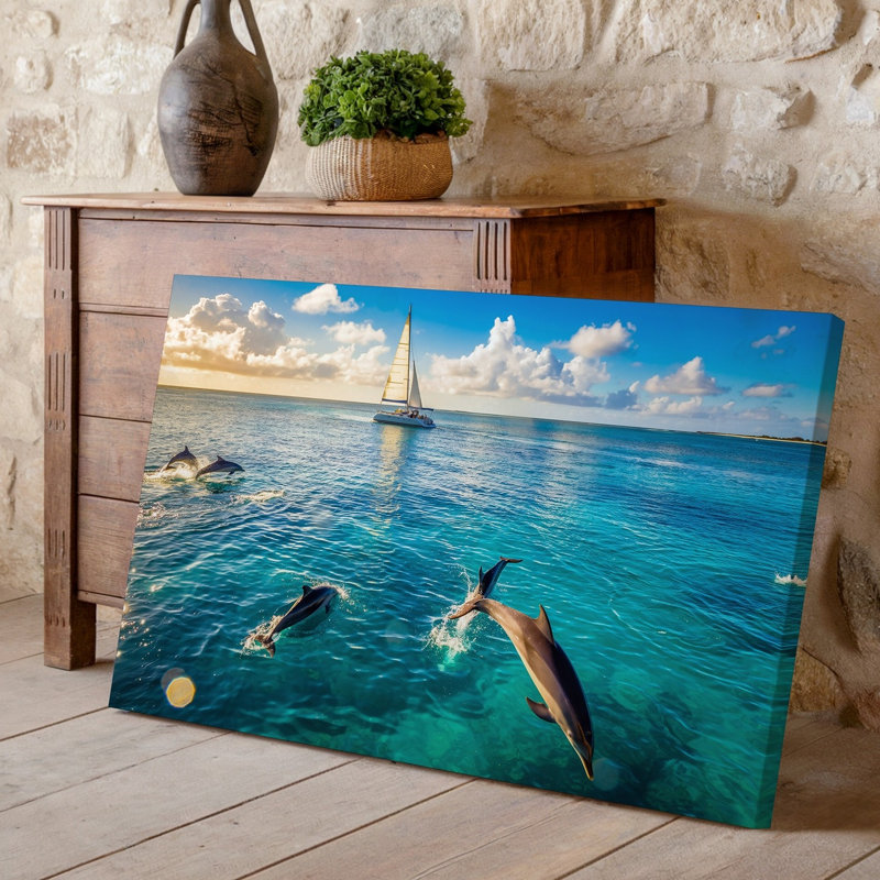 Toile, une scène sereine de l'océan mettant en vedette des dauphins ludiques qui sautent gracieusement à travers une eau turquoise transparente