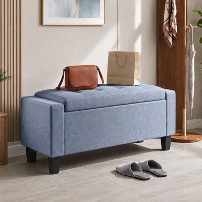Banc ottoman de rangement en tissu capitonné avec accoudoirs et pieds en bois