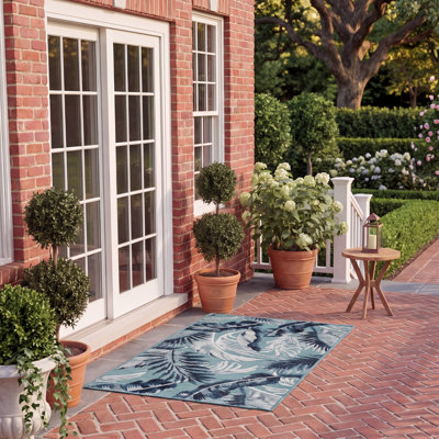 Abbriella Machine Woven Floral Area Rug
