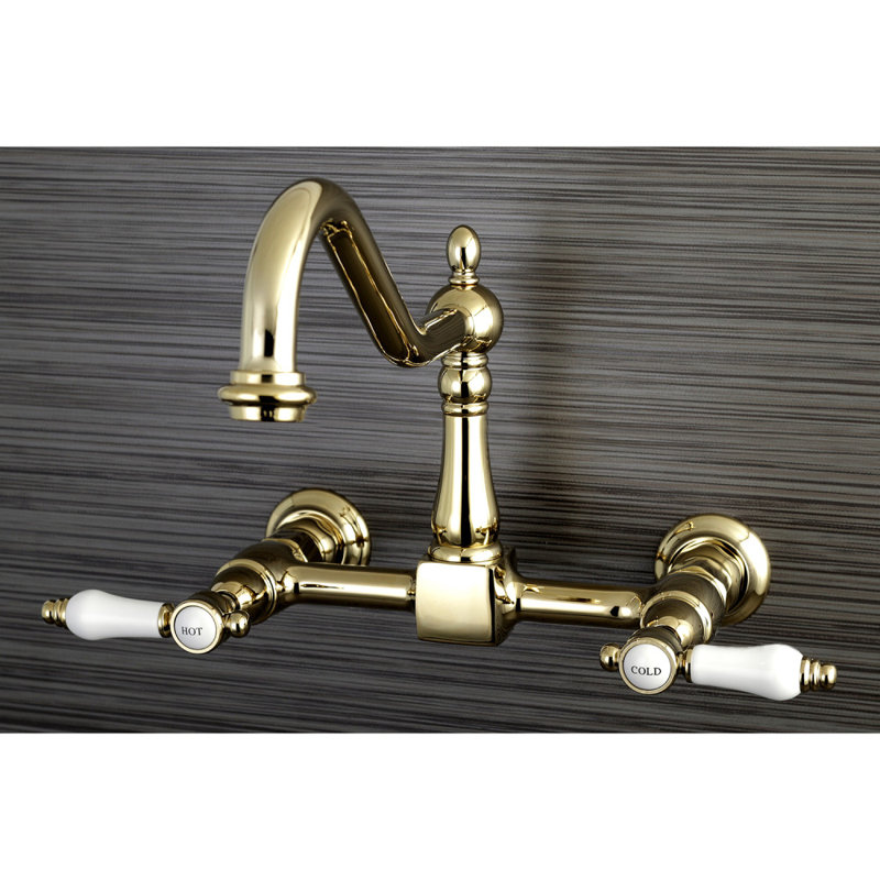 Kingston Brass Essex Double-Handle Wall-Mount Bridge Kitchen Faucet, Polished Brass, Without Side Spray, Porcelain Lever 