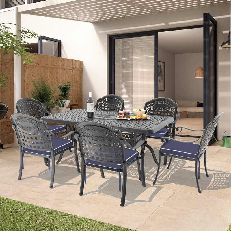 Shannda 7-Piece Cast Aluminum Patio Dining Set with 68.9" Rectangular Table, Umbrella Hole & Blue Cushions