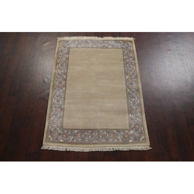 Tapis oriental népalais à bordure en laine 4 x 5