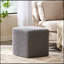 Repose-pieds doux tricoté avec couche extérieure facile à nettoyer, parfait pour le confort et le style dans n'importe quel salon.