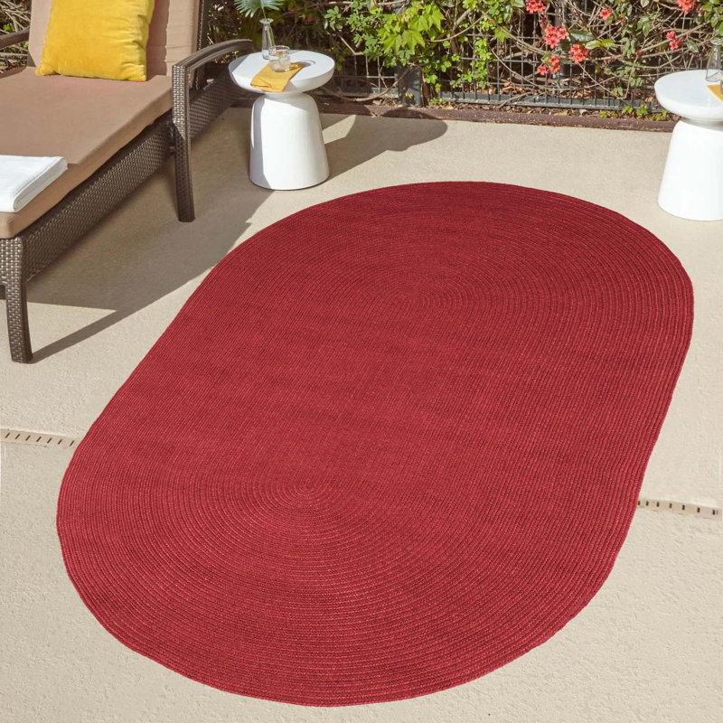 Neufeld Hand-Braided Indoor/Outdoor Burgundy Area Rug, Oval 8' x 10'