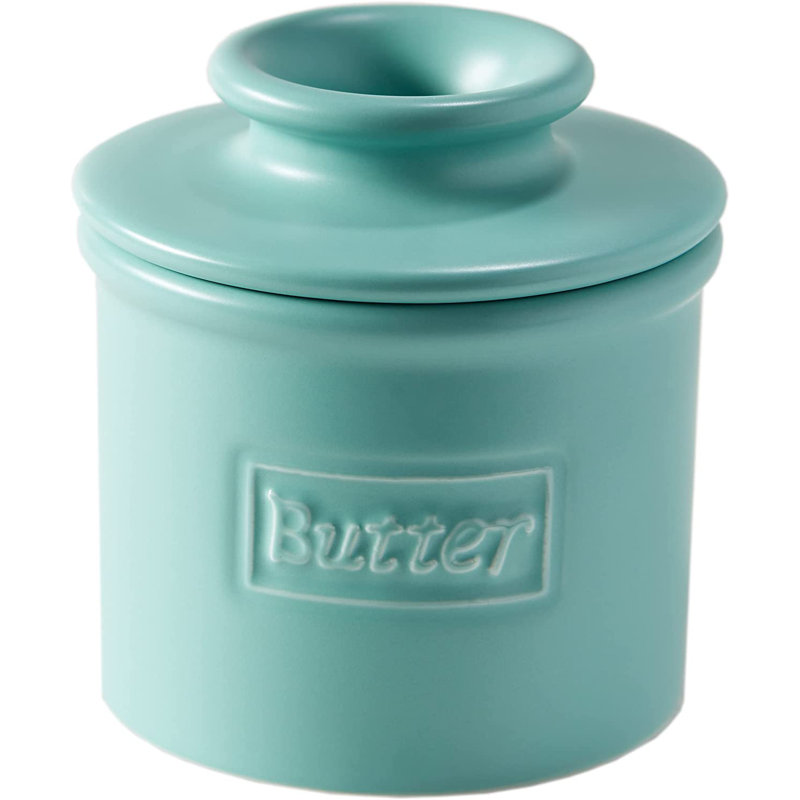 Butter dish in matte aqua ceramic with embossed Butter lettering.