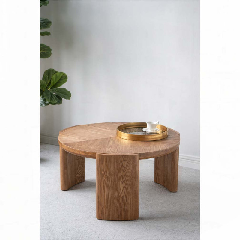 Table basse ronde avec pieds incurvés