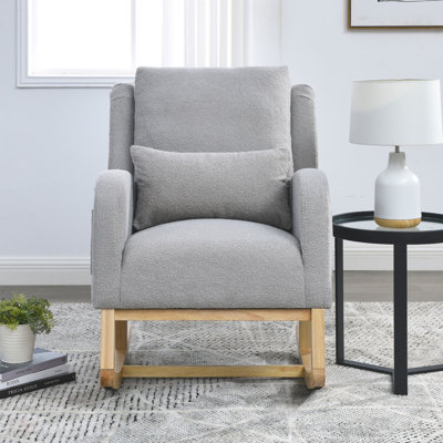Fauteuil à bascule de salon moderne à dossier haut avec un coussin lombaire et deux poches latérales