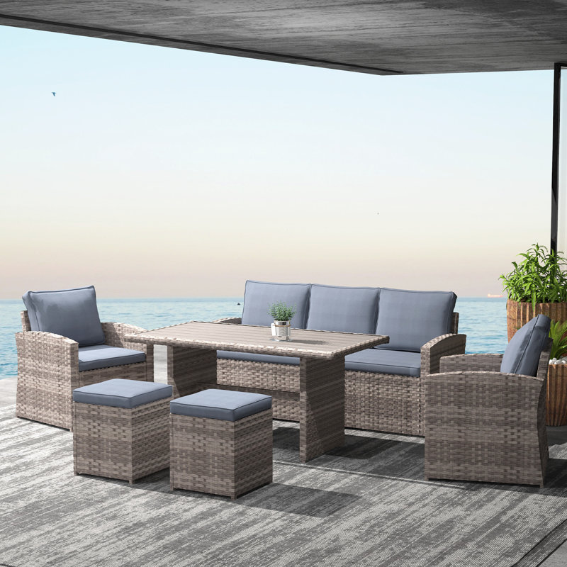 Berthilde 7 - Person Wicker Patio Dining Set with Rectangular Table , Cushions Included, Gray, Brown
