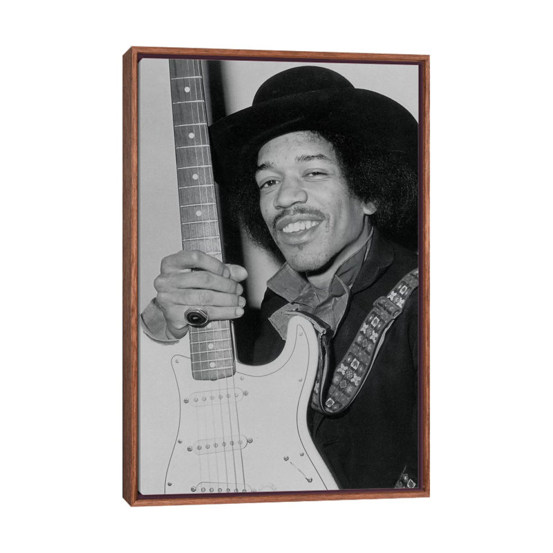 A Smiling Jimi Hendrix Holding His Guitar by Radio Days - Print on Canvas, 101.6 cm H x 66.04 cm W, Classic Brown Wood Framed