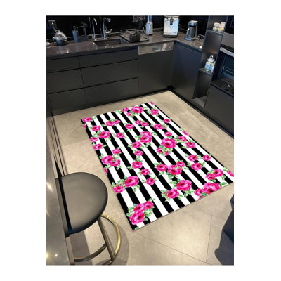 Tapis tissé à motif floral rose