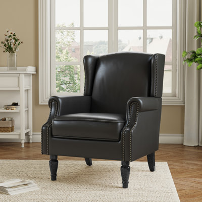 Duward Upholstered Faux Leather Wingback Accent Chair with Nailhead Trim by Alcott Hill