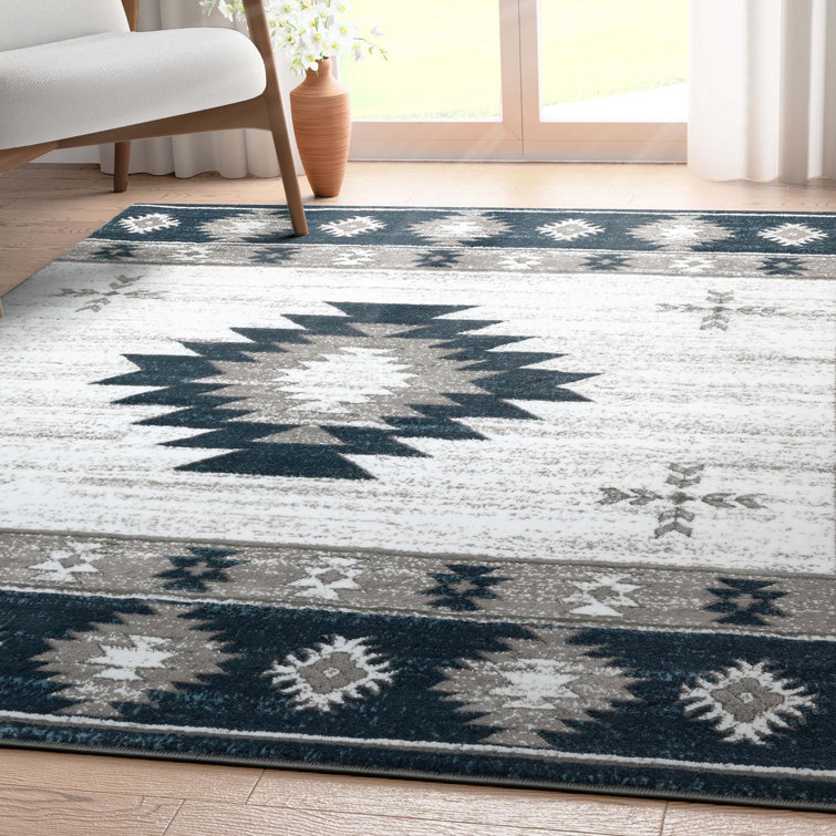 Giselly Southwestern Machine Woven Polypropylene Area Rug in Navy/Ivory