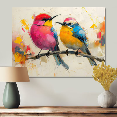 Oiseaux roses et jaunes sur une branche florale