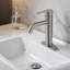 Robinet pour salle de bain à poignée simple en nickel brossé avec bonde escamotable