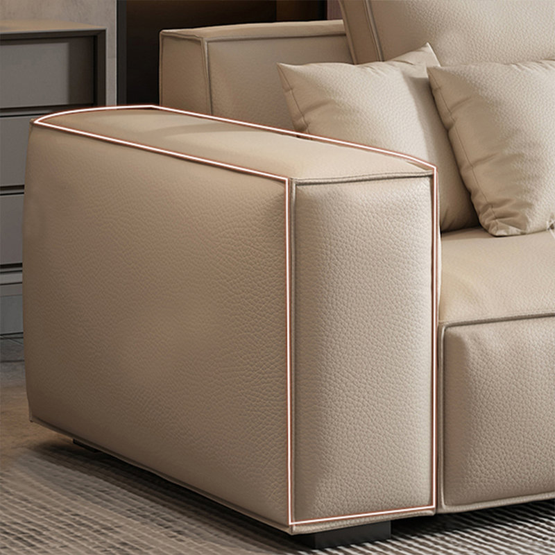 Chaise avec accoudoirs coussinée en cuir véritable beige avec repose-pieds