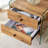 Double-drawer bedside table. The board surface is MDF with grain sticker, and both sides are transparent tempered glass. The design is simple and elegant, with excellent storage functions-1433599278