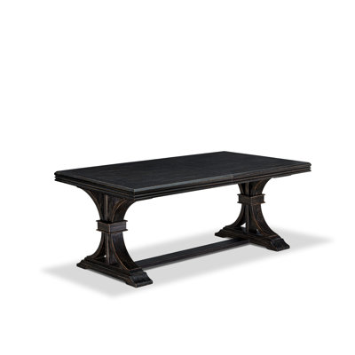 A wooden dining table with removable rectangular tabletop