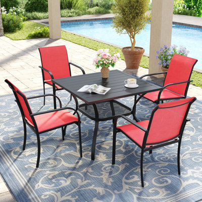 Ensemble de salle à manger de patio pour 4 personnes avec chaises empilables PVC-coated polyester