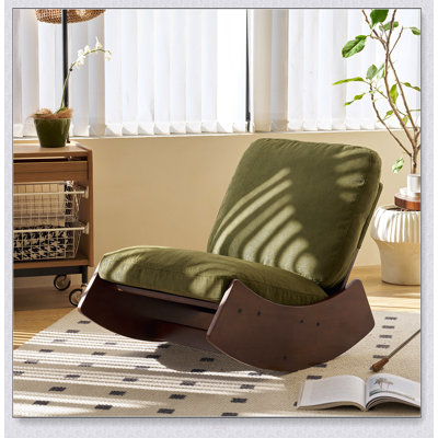 Chaise berçante confortable avec revêtement de haute qualité et structure en bois massif, parfaite pour la détente et la durabilité.