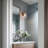 1-Light Black & Brass Wall Sconce with Seeded Glass Shade