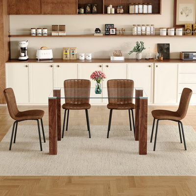 Table And Chair Set.A Transparent Tempered Glass Dining Table With Walnut Wood Grain MDF Legs.Paired With 4 Brown Technology Fabric Dining Chairs With Black Metal Leg.