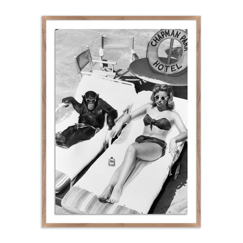 Woman Sunbathing With Chimpanzee by Getty Images, Rustic Walnut Framed, 40" H x 30" W