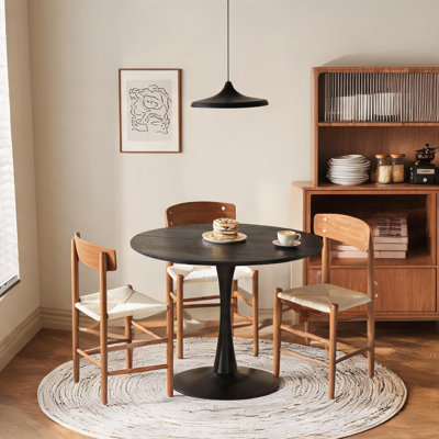 Table de salle à manger résistante à l'eau, combinant une structure en métal, un élégant design noir et un diamètre de 100 cm (39,4 pouces) pour salle à manger