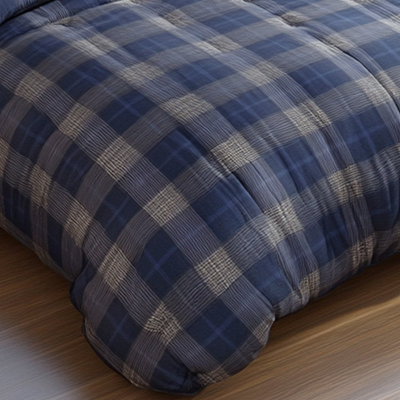 Couette douillette à carreaux gris