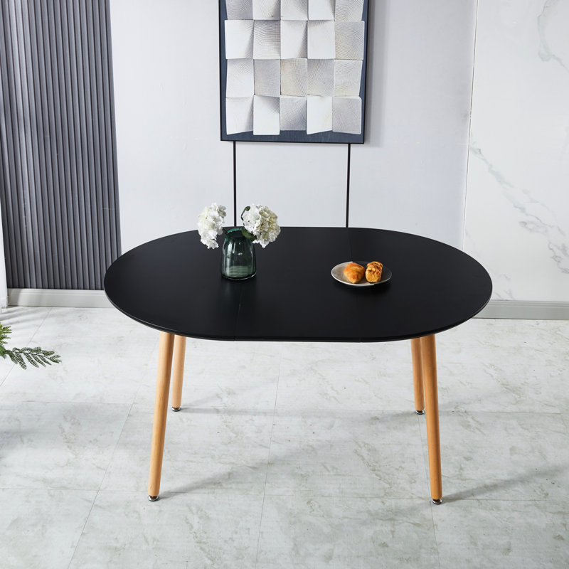 Table basse noire avec design extensible, plateau et pieds en métal, 140 x 100 x 75 cm, détails uniques, idéal pour la salle à manger, design innovant