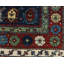 Seychour Wool Oriental Area Rug in Green/Red