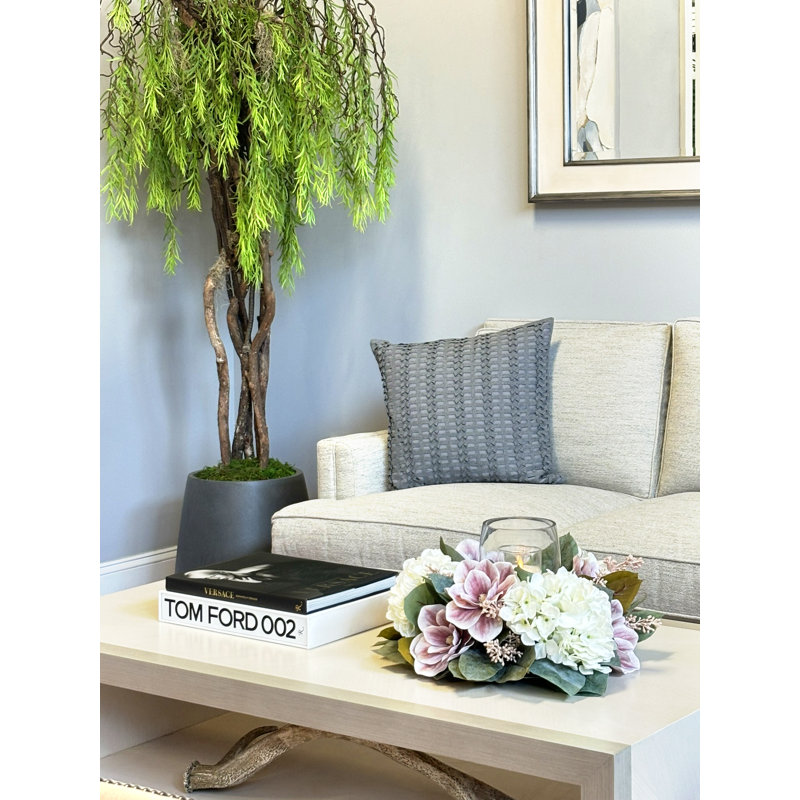 Centre de table bougeoir avec magnolias et hortensias