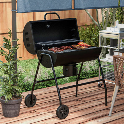 Barbecue au charbon avec 420 pieds carrés Surface de cuisson et roulettes pour le plaisir en plein air. Idéal pique-nique de patio, rassemblement dans la cour. Comprend un thermomètre intégré et un capteur de cendres sur roues. Convient