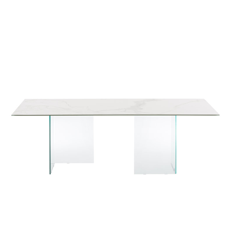 Table de salle à manger Miami avec base transparente et plateau en porcelaine marbrée blanche.