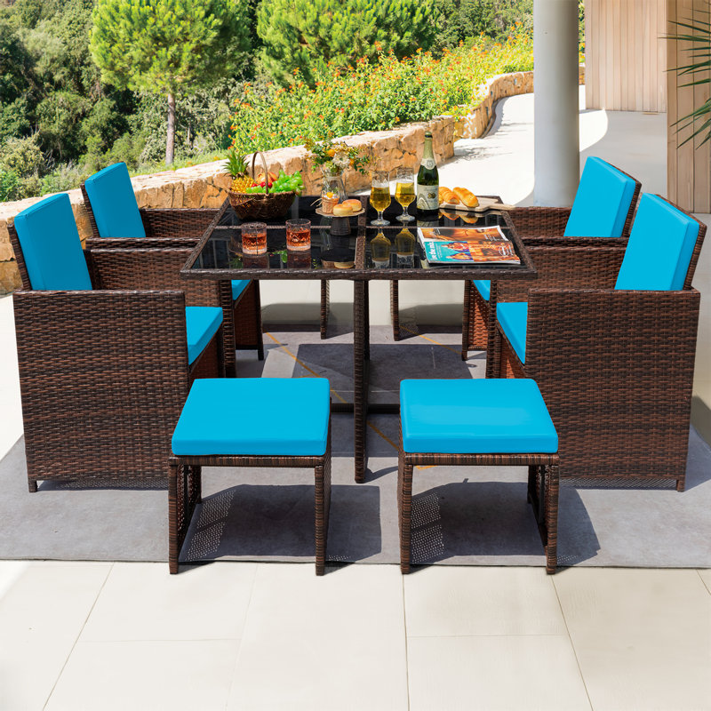 Angelos 8 - Person Wicker Patio Dining Set with Rectangular Table , Cushions Included, Blue