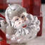 Ensemble de 4 décorations de Noël en verre représentant le Père Noël blanc