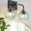 Luminaire de meuble-lavabo de style art déco avec abat-jour en verre nervuré vert, applique murale de style campagne moderne à 2 lumières pour miroir de salle de bain, cuisine, salon, finition noire et dorée