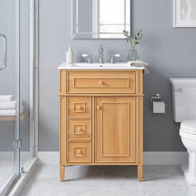 Meuble-lavabo moderne autoportant 24 po en bois avec lavabo intégré en céramique, tiroir supérieur inclinable, 2 tiroirs à fermeture en douceur, pieds en bois massif, poignées en bois et tablettes réglables